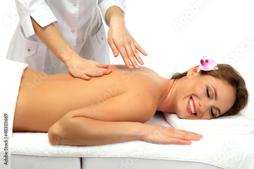 beautiful woman in spa salon getting massage, isolated on