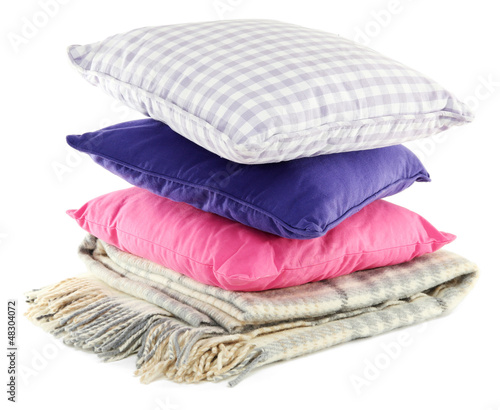 Colorful pillows and plaid isolated on white