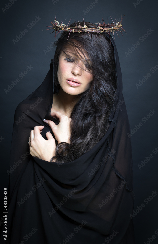 Praying woman in crown of thorns. Praying woman in crown of thorns.