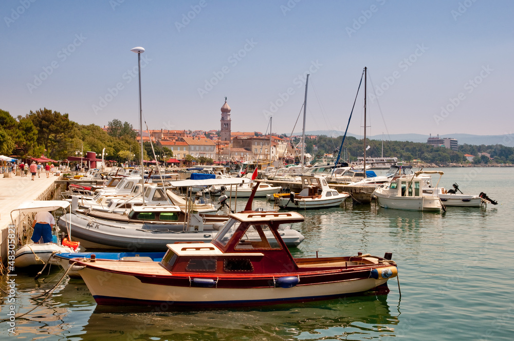 Ships and boats docked at Krk city Port - Croatia