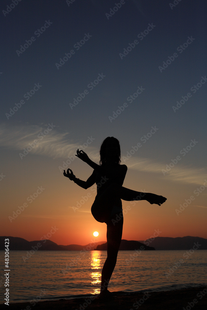 silhouette of a girl at the beach