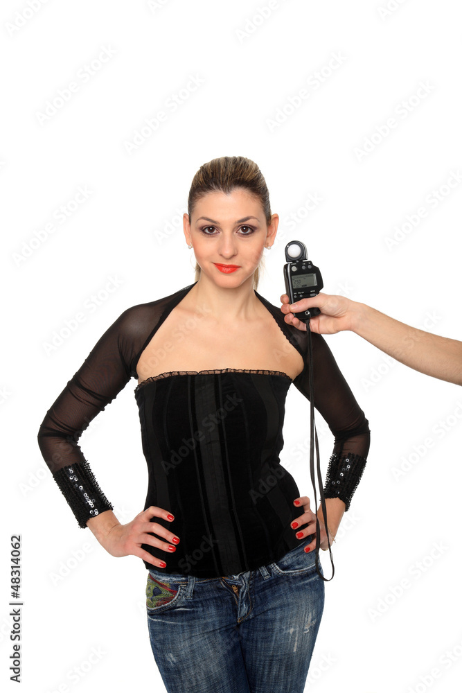 girl and a lightmeter on a studio girl and a lightmeter on a studio