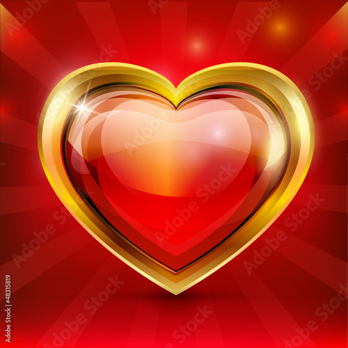 Red glass heart in a gold frame. Valentine's Day.