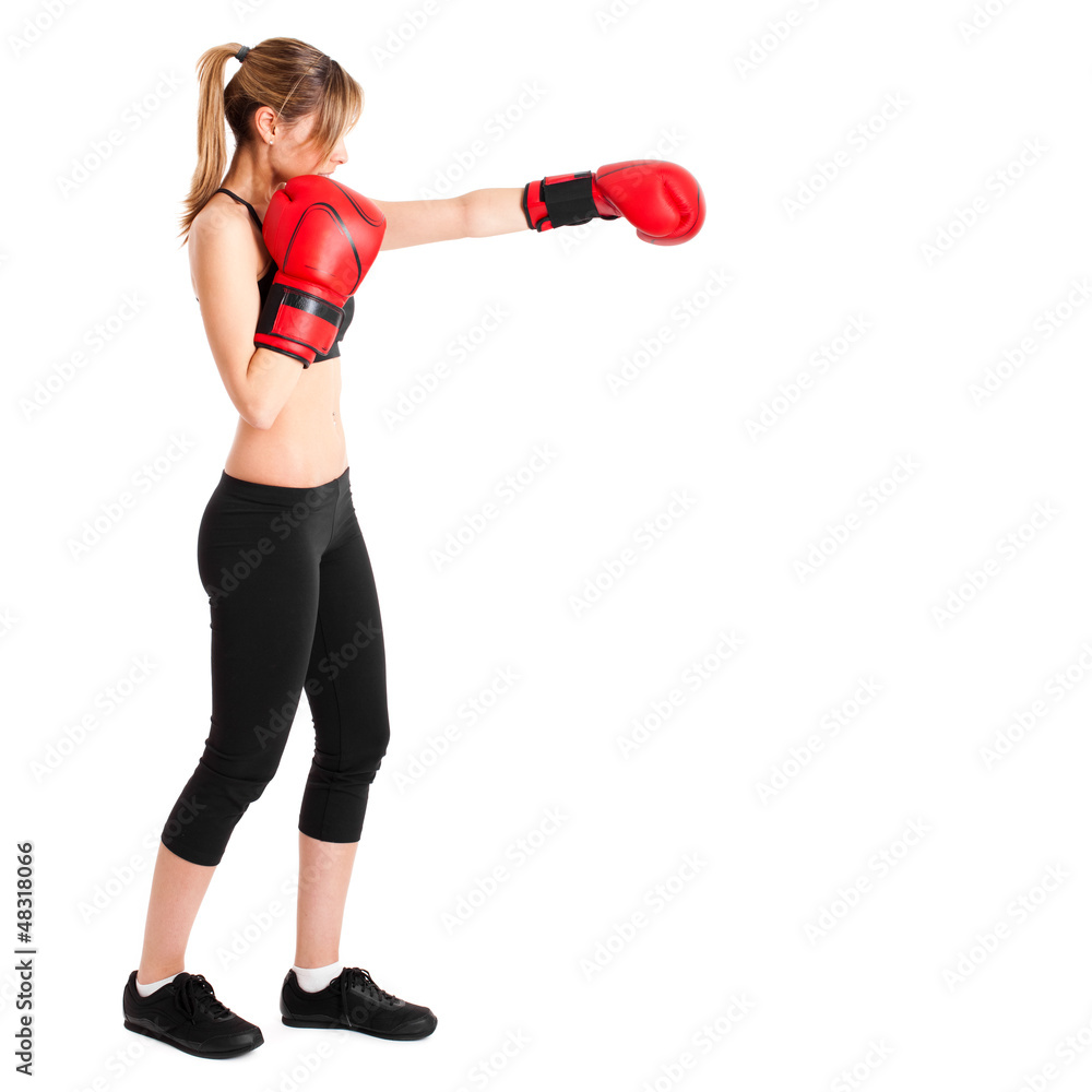 Young woman wearing boxe gloves isolated on white