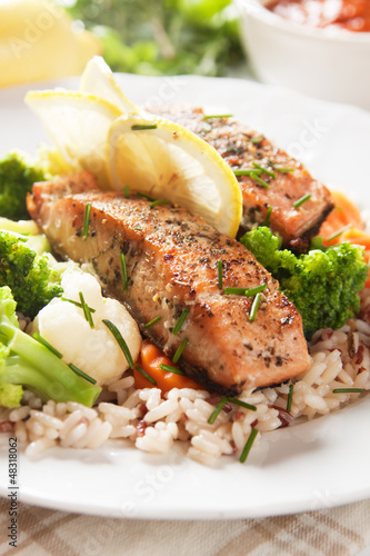 Grilled salmon steak vith cooked rice photo