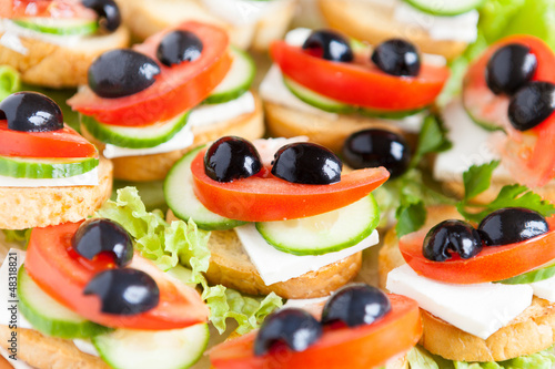 sandwiches with soft cheese and olives