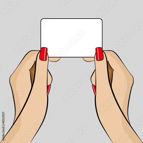 Womans hand holding a business card