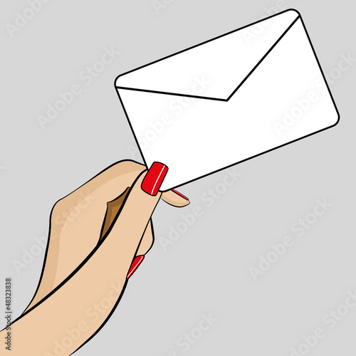Womans hand holding an envelope