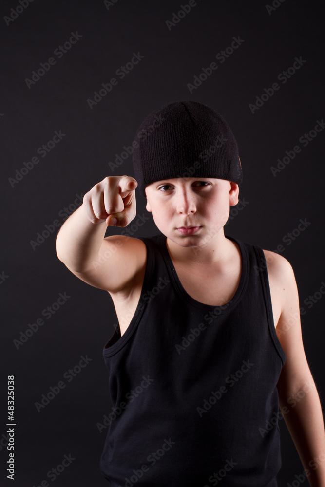 boy in black hat points the finger boy in black hat points the finger