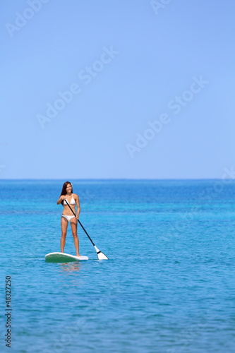 Hawaii beach lifestyle woman paddleboarding