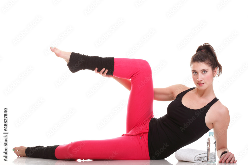 Obraz premium beautiful young brunette woman stretching muscles arms isolated