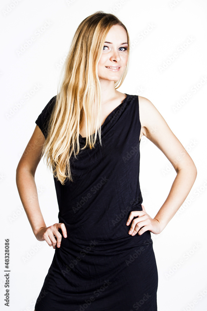 A beautiful young woman in a gray dress