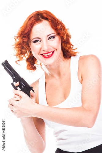 Young and beautiful woman with a gun