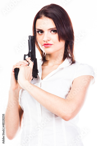 Young and beautiful woman with a gun