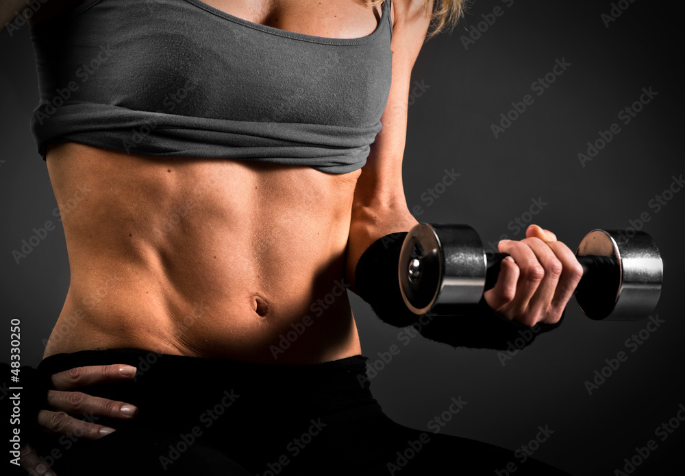 Naklejka premium Fit woman abdomen muscle definition