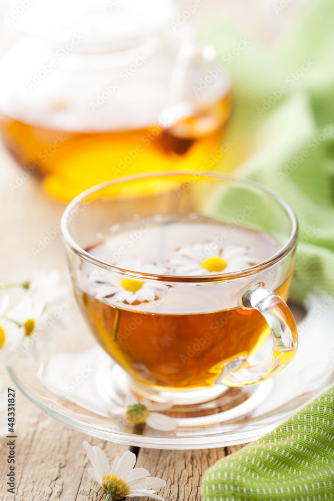 cup of herbal tea with camomile flowers cup of herbal tea with camomile flowers