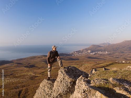 Man on the top of the mountain