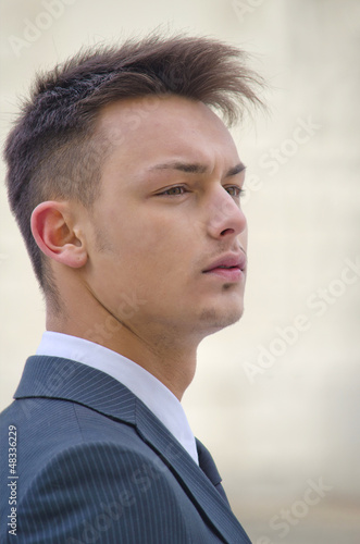Profile portrait of young businessman in suit © theartofphoto