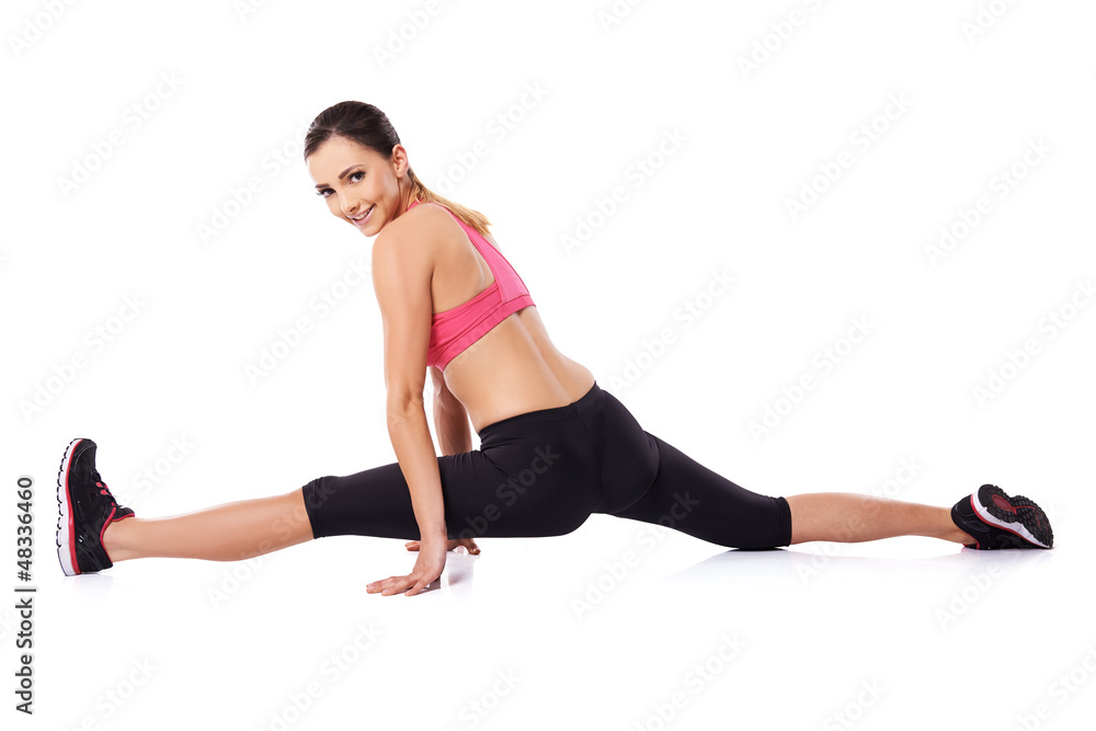 Pretty smiling woman doing the splits Pretty smiling woman doing the splits