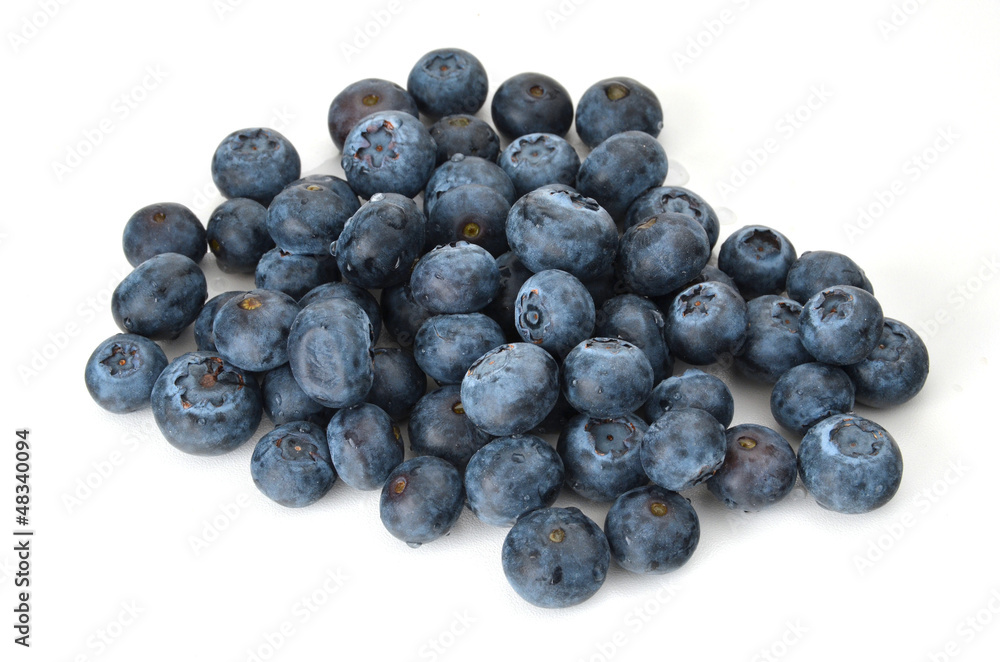 A small pile of blueberries on white background A small pile of blueberries on white background
