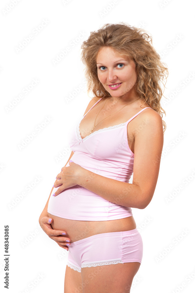 Pregnant woman is caressing her belly Pregnant woman is caressing her belly