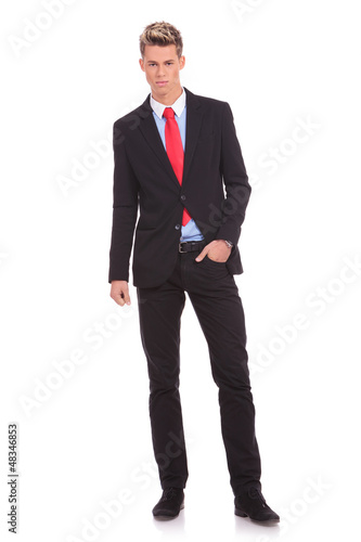 man standing with hand in pocket