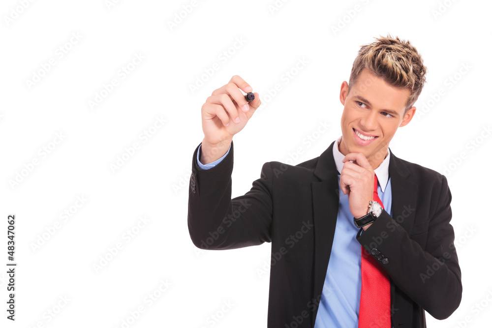 pensive business man is writing something pensive business man is writing something