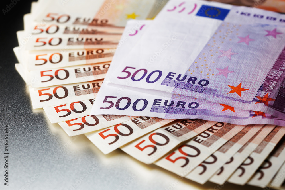 3000 Euro on a shiny polished aluminum board 3000 Euro on a shiny polished aluminum board