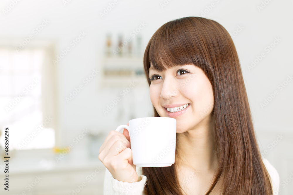 Beautiful asian woman in the kitchen Beautiful asian woman in the kitchen