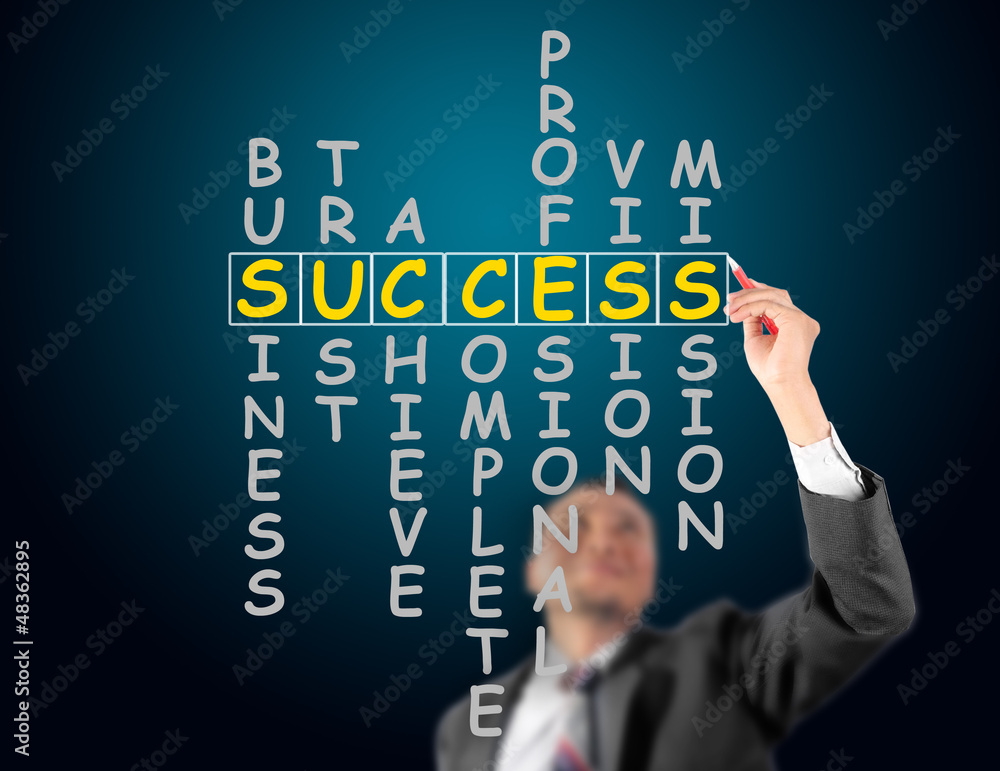 Business man writing success crossword Business man writing success crossword