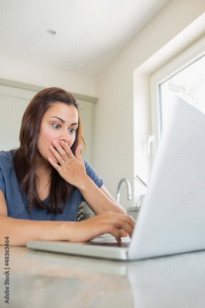 Surprised woman using the laptop Surprised woman using the laptop