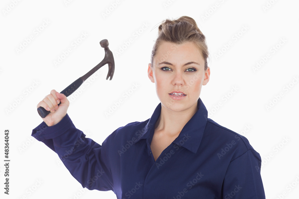 Female technician holding claw hammer
