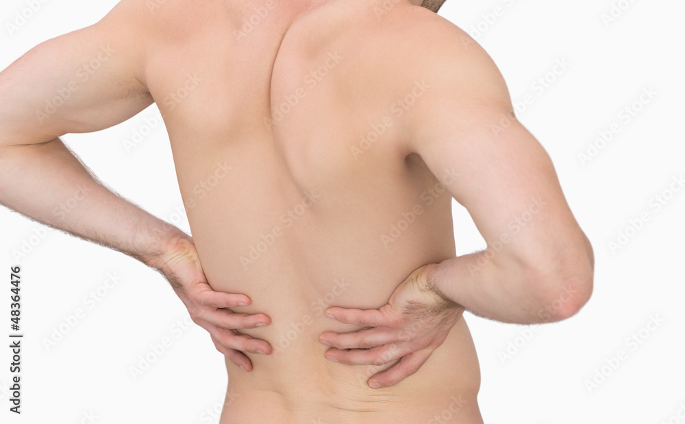 Rear view of muscular man with backache Rear view of muscular man with backache