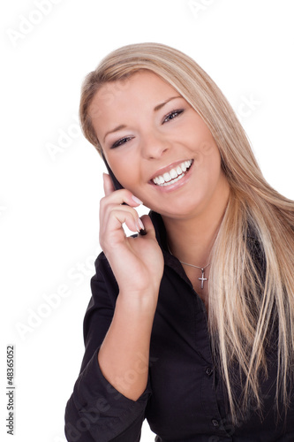 Joyful woman listening to her mobile