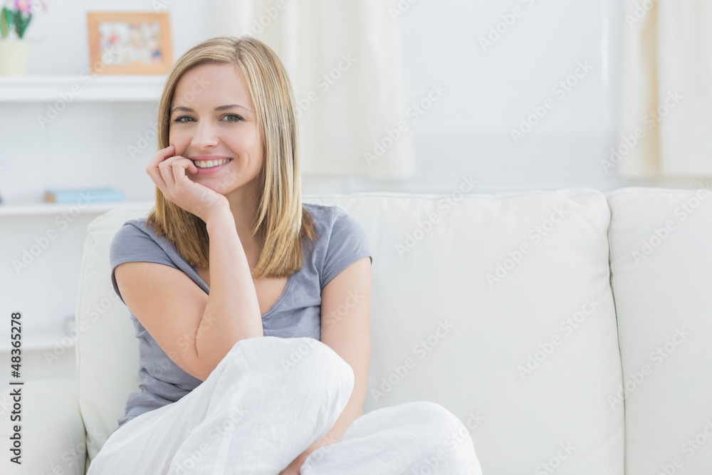Portrait of relaxed woman sitting on couch Portrait of relaxed woman sitting on couch