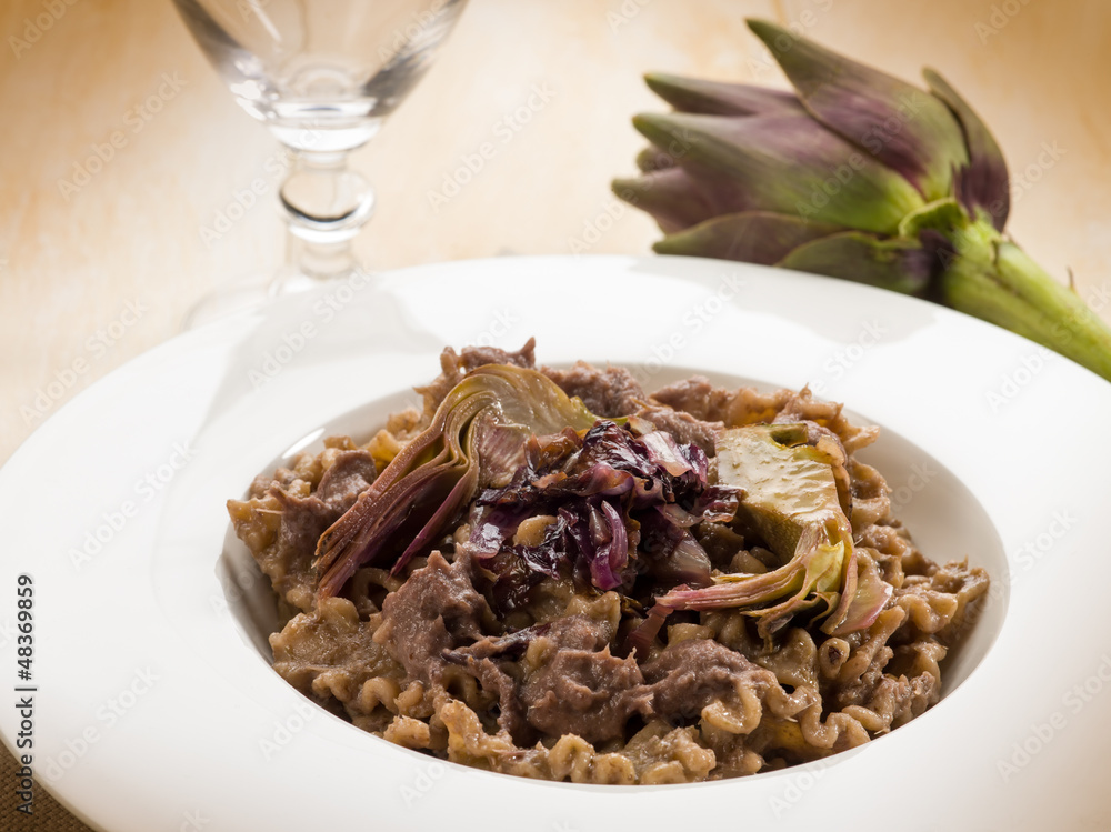 integral pasta with artichoke and chicory, vegetarian food integral pasta with artichoke and chicory, vegetarian food