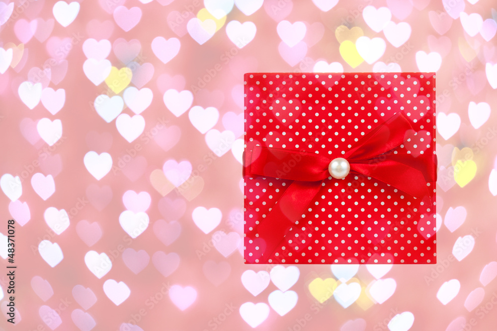 Red gift box on heart bokeh