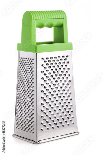 Metal grater with rubber handle Isolated on white background photo