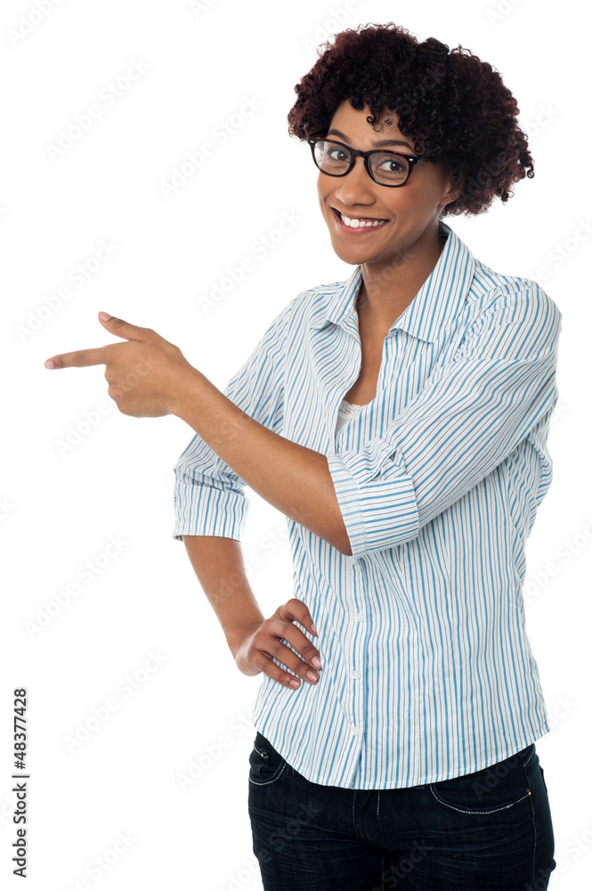 Casual business lady indicating sideways Casual business lady indicating sideways