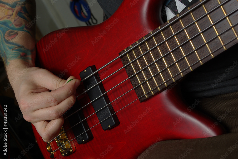 Fototapeta premium Playing on red guitar
