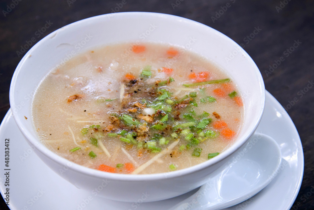 Traditional thai porridge rice gruel in bowl, con gee Traditional thai porridge rice gruel in bowl, con gee