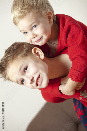 Two boys playing and embracing