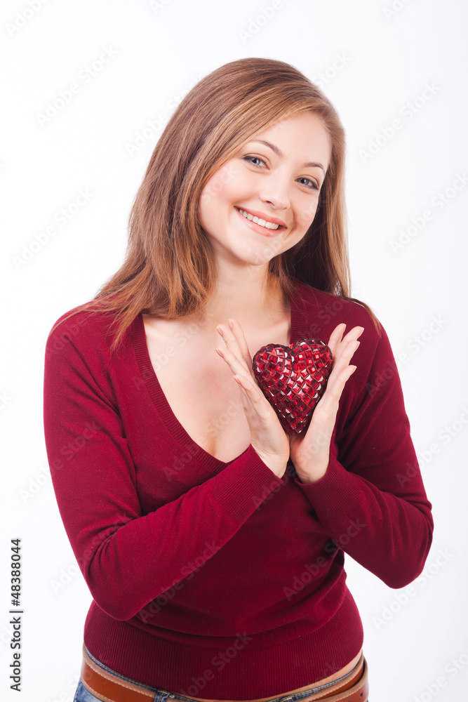 smiling woman holding heart shape smiling woman holding heart shape