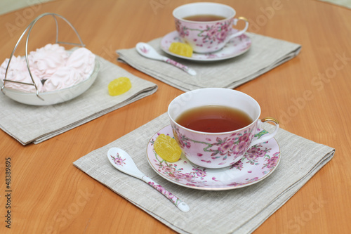 Romantic tea served in beautiful cups with marshmallow