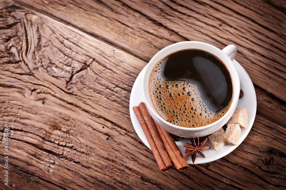 Obraz premium Cup of coffee with brown sugar.