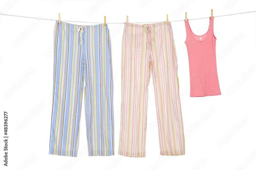 Female shirt and trousers clothespins on rope Female shirt and trousers clothespins on rope