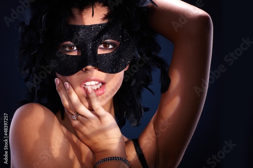 Seductive portrait of woman in masquerade