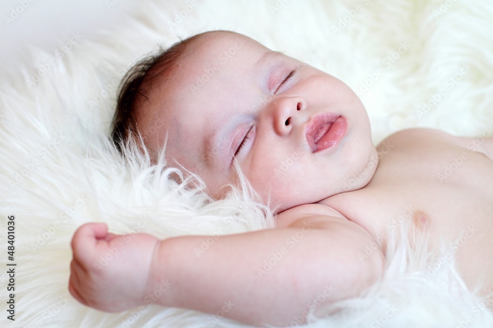 The baby sleeping on a fur plaid (3,5 months) The baby sleeping on a fur plaid (3,5 months)