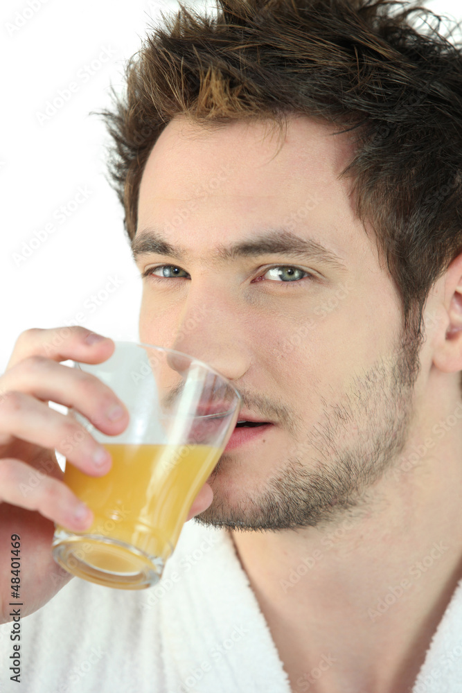 man drinking orange juice man drinking orange juice