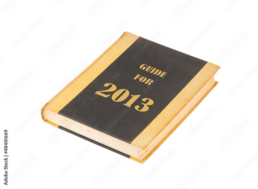 Old book with a guide for 2013 concept title Old book with a guide for 2013 concept title